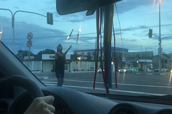 A Venezuelan performs at an intersection in Boa Vista, Brazil.