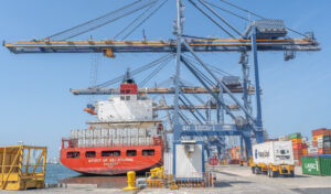 A port in Cartagena Colombia receives shipping containers as supply chains continue to shift creating challenges and opportunities.