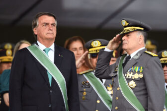 General Freire salutes Bolosnaro during a celebration at Army headquarters in Brasilia.