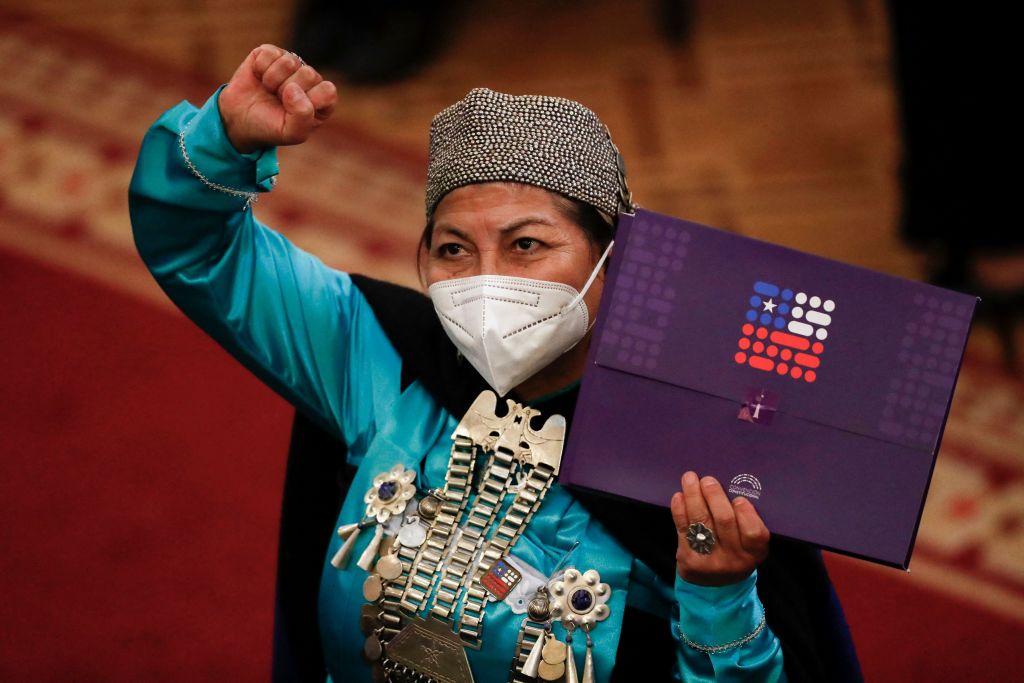 Elisa Loncon, an Indigenous woman who was first president of Chile's Constitutional Convention, holds the final draft of the constitution. Chileans will vote on the draft on September 4.