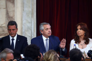 Argentina's President Alberto Fernández sits with Economy Minister Sergio Massa, who will try to fix Argentina's economy and high inflation.