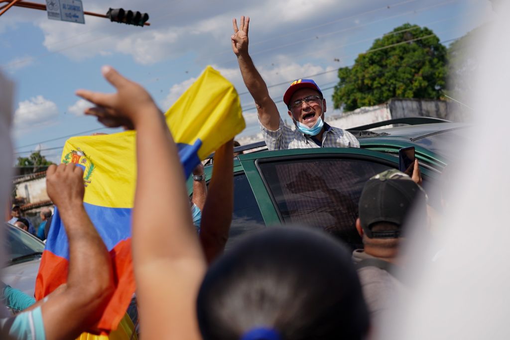 Opposition candidates Sergio Garrido celebrates after defeating Maduro's candidate in a special election for governor of Barinas state.