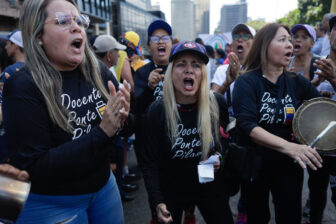 Demonstrators shout slogans demanding better wages during the International Workers Day March in Caracas, Venezuela on May 1, 2023. (Photo by Javier Campos/NurPhoto via Getty Images)