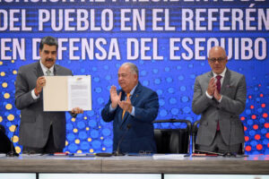 President Nicolás Maduro of Venezuela receives an official copy of the referendum results that approve his idea of seizing much of Guyana's territory.