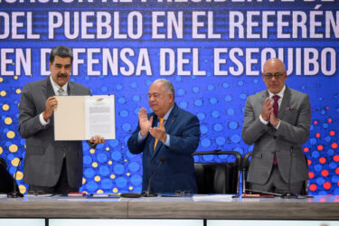 President Nicolás Maduro of Venezuela receives an official copy of the referendum results that approve his idea of seizing much of Guyana's territory.