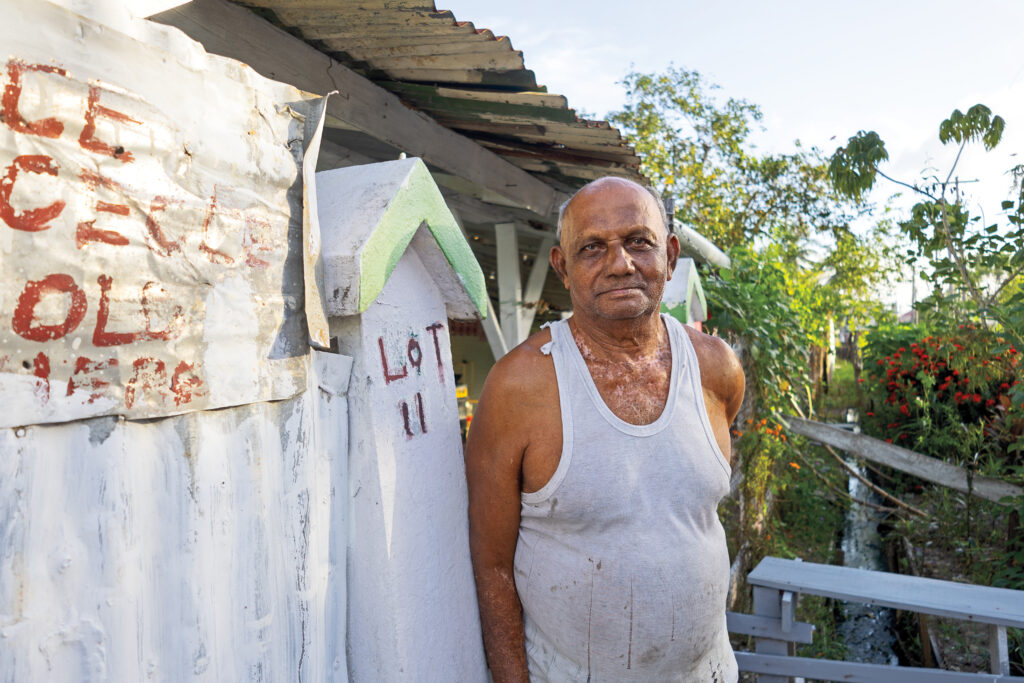 Retired sugarcane cutter Hari Persaud stands outside of his home. (José Enrique Arrioja)