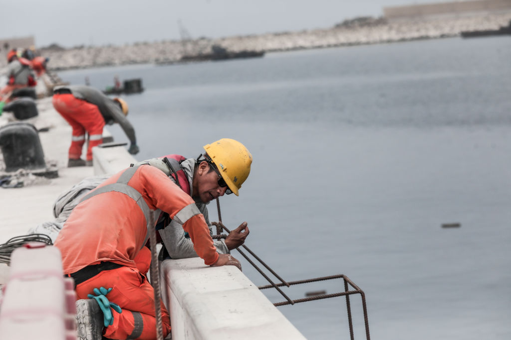 Workers construct a new port in Chancay, Peru in March. Can Copper Prices and Nearshoring Restart Peru’s Economic Dynamism?