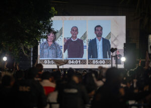 The public watches a presidential debate between Xochitl Galvez, Claudia Sheinbaum and Jorge Alvarez Maynez in Mexico City in April.