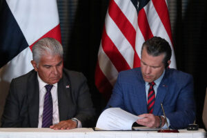 Panama's President Jose Raul Mulino looks on as US Secretary of Defense Pete Hegseth signs a bilateral agreement, in Panama City on April 9, 2025. Hegseth arrived in Panama for the regional security summit and to reinforce the Trump administration's continued interest over the canal.