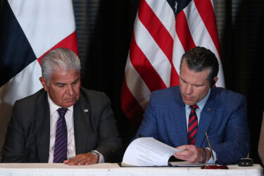 Panama's President Jose Raul Mulino looks on as US Secretary of Defense Pete Hegseth signs a bilateral agreement, in Panama City on April 9, 2025. Hegseth arrived in Panama for the regional security summit and to reinforce the Trump administration's continued interest over the canal.