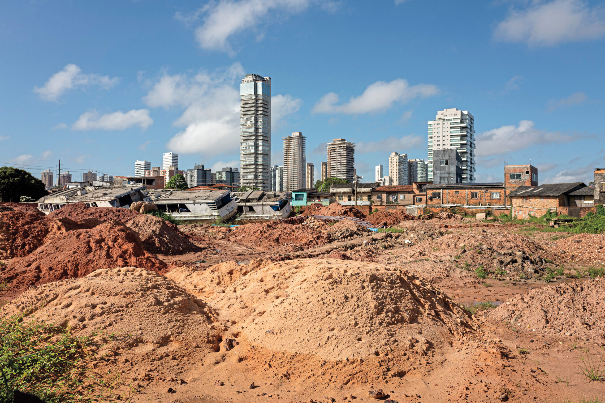 A former community soccer field in the low-income area of Vila da Barca has been turned into a debris dump for waste generated by COP30 construction.