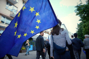 A woman carries a European Union flag in Warsaw, Poland in May 2025. Why Europe Needs Latin America
