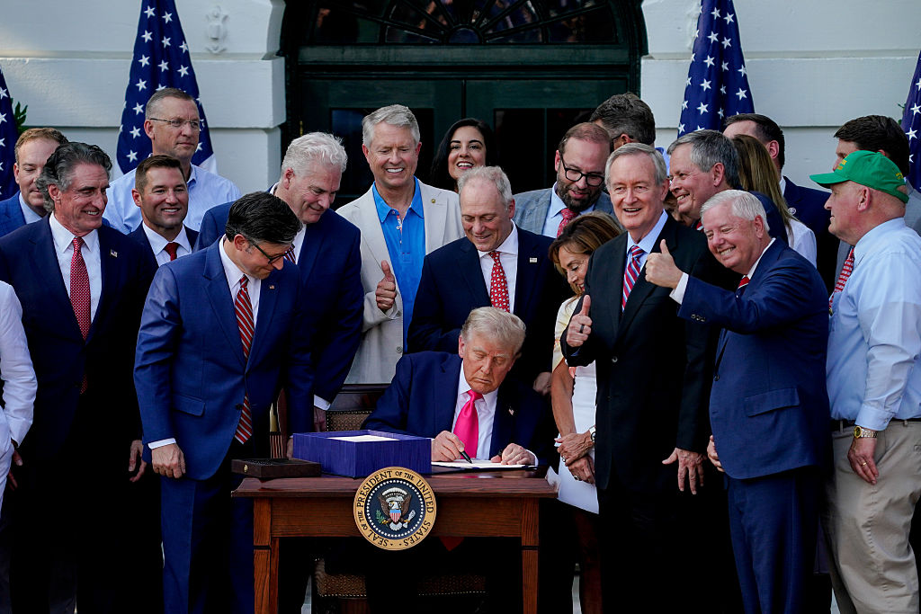 What Trump’s ‘Big, Beautiful Bill’ Means for the Americas: U.S. President Donald Trump signs the One Big Beautiful Bill Act on the South Lawn of the White House in Washington, DC, US, on Friday, July 4, 2025.