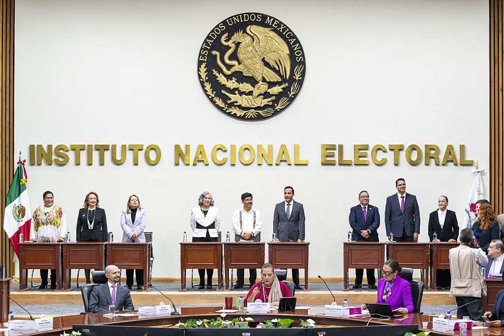 Supreme Court of Justice of the Nation Ministers Lenia Batres, from left, Yasmin Esquivel Mossa, Loretta Ortiz Ahlf, Maria Estela Rios, Hugo Aguilar Ortiz, Giovanni Azael Figueroa, Irving Espinosa Betanzo, Aristides Rodrigo Guerrero and Sara Irene Herrerias at the National Electoral Institute in Mexico City, Mexico, on Sunday, June 15, 2025. Mexico's new Supreme Court will feature a clear majority of justices with direct ties to the country's former leftist president or the ruling Morena party he founded.