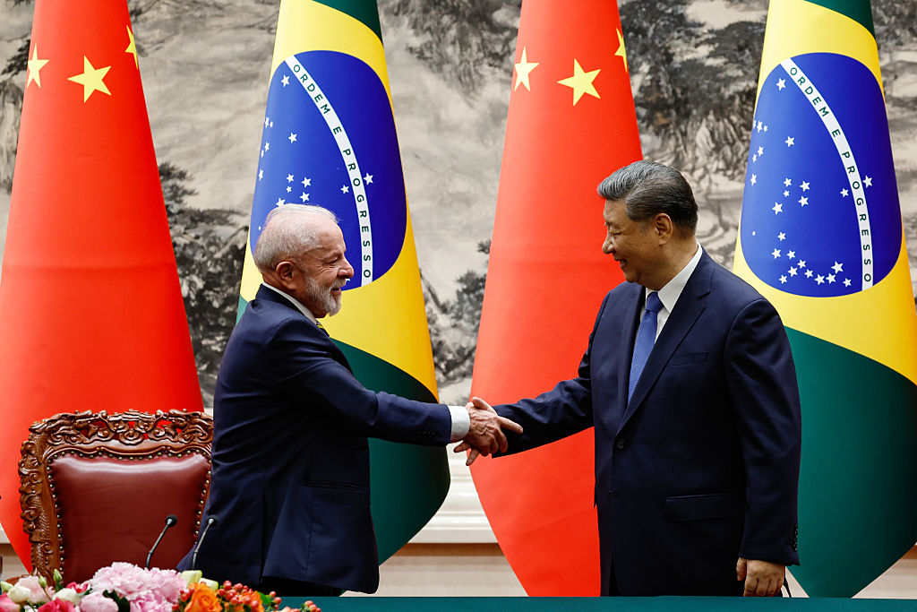 Luiz Inácio Lula da Silva and Xi Jinping shake hands in Beijing at the May China-CELAC Forum.