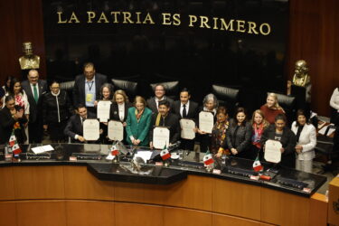 The new Mexico's Supreme Court chief, Hugo Aguilar Ortiz (C), and the first judges elected by popular vote pose for a photo during the inauguration ceremony at the Senate of the Republic in Mexico City on September 1, 2025. Hugo Aguilar Ortiz, an Indigenous rights defender and former advisor to the Zapatista guerrilla movement, is Mexico's first Supreme Court chief justice elected at the ballot box. Mexico ushers in a 'new era' with the inauguration of the first judges elected by popular vote, a milestone for justice in a country damaged by impunity, but one that leaves it exposed to the influence of political power and organised crime.