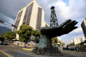 A sculpture of a hand holding an oil drilling rig outside the state-run Petroleos de Venezuela S.A. in Caracas in February 2025.
