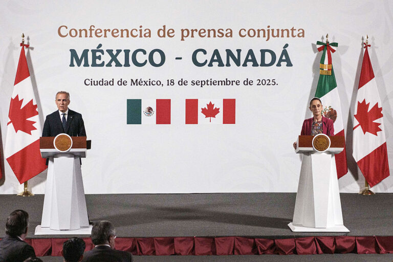 Claudia Sheinbaum, Mexico's president, right, and Mark Carney, Canada's prime minister, speak in Mexico City, Sept. 18, 2025.
