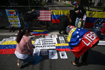 Members of the Venezuelan diaspora call for the release of political prisoners outside the U.S. embassy in Bogota on January 19, 2026.