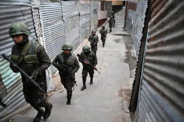 Guatemalan Army soldiers patrol a street of the Nueva Jerusalen neighborhood during the state of emergency declared by the government in Guatemala City on January 20, 2026. Guatemalan soldiers began patrolling gang-controlled neighborhoods in the capital on January 20, after attacks that left ten police officers dead and prompted the government to declare a state of siege, according to official sources and an AFP journalist. (Photo by JOHAN ORDONEZ / AFP via Getty Images)
