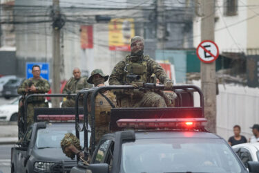 Security forces following a large-scale police operation targeting the Comando Vermelho gang in Rio, Oct. 2025.