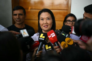 Keiko Fujimori speaks to the press outside her home in Lima on June 11.
