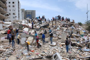 Teams remove debris on a collapsed building after an earthquake in Caracas, Venezuela, on June 25, 2026. 