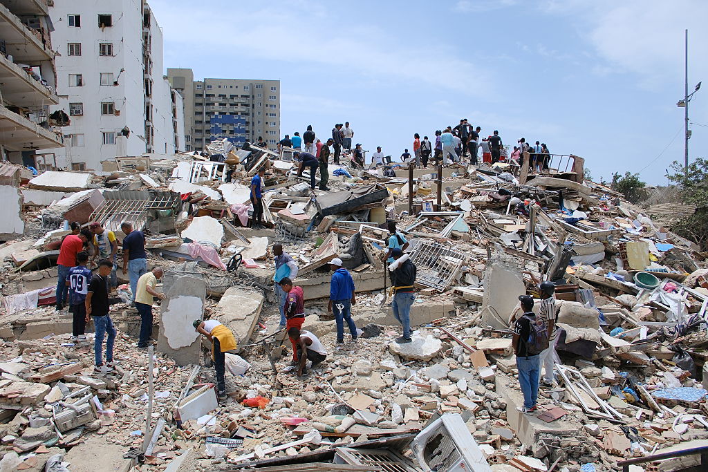 Teams remove debris on a collapsed building after an earthquake in Caracas, Venezuela, on June 25, 2026. 