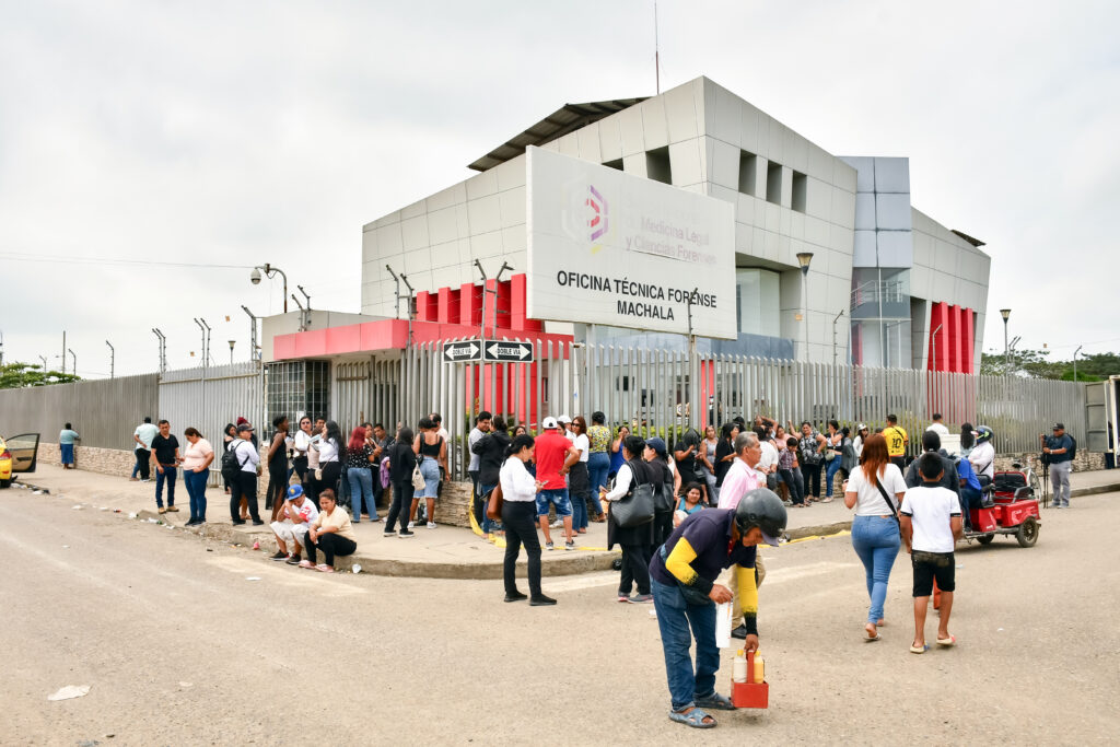 Relatives wait to identify the bodies of inmates after a prison riot left 31 dead in Machala, Ecuador, in November.