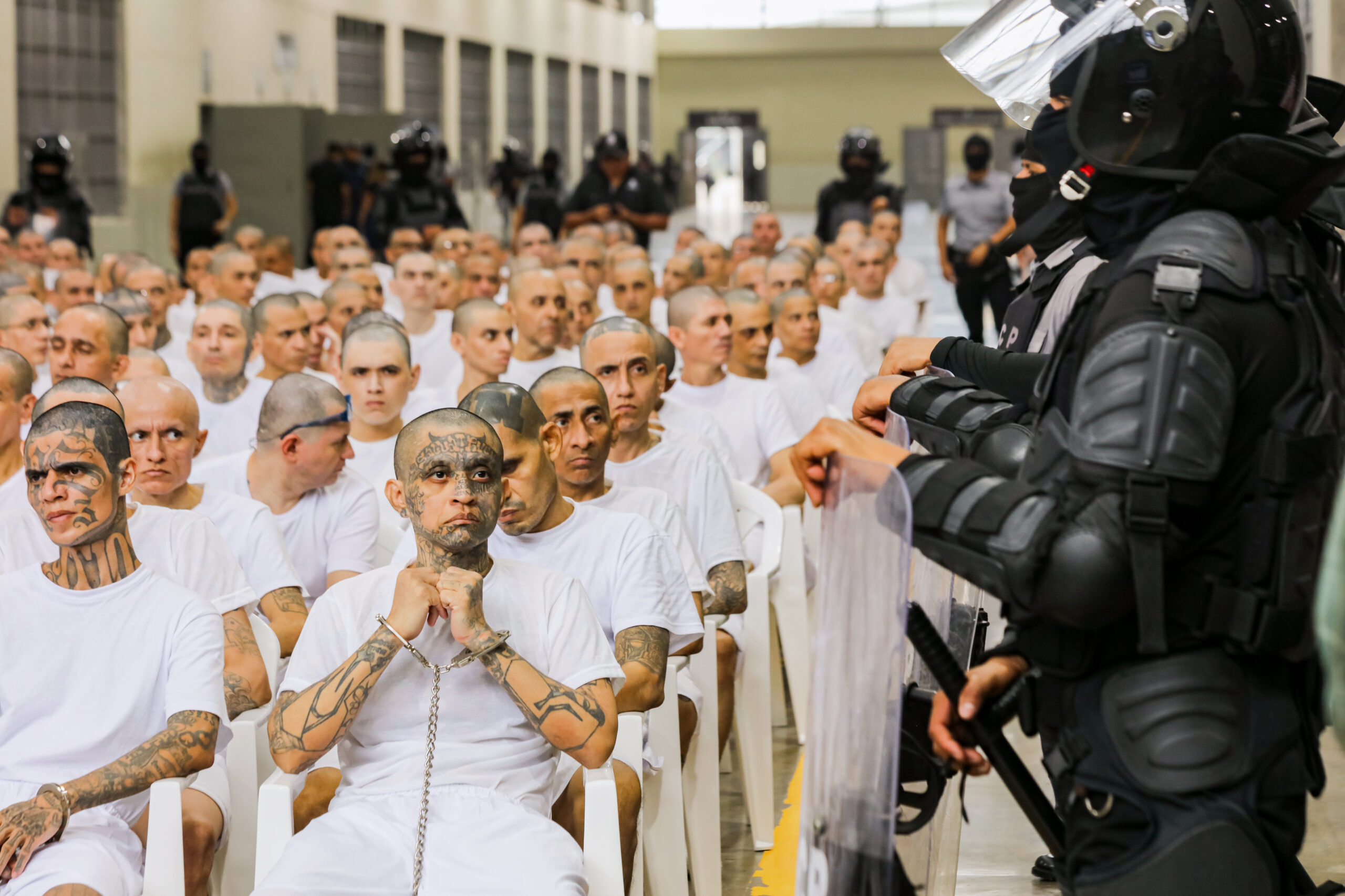 Inmates of El Salvador’s CECOT mega-prison attend a mass criminal hearing in April.