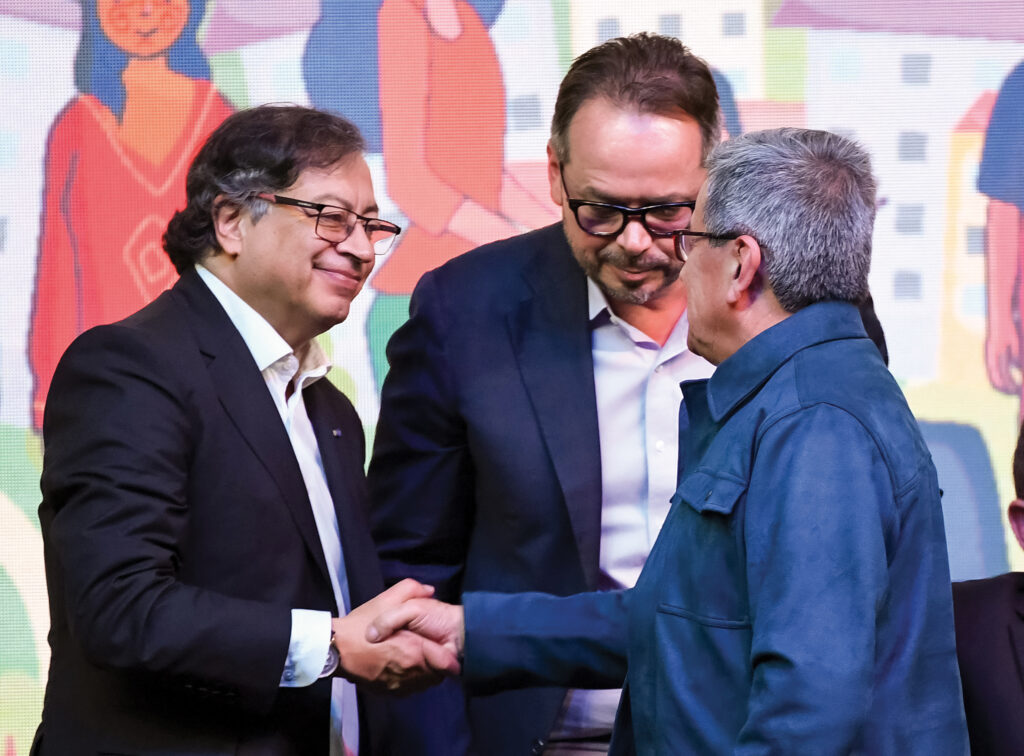 Former President Gustavo Petro (L) meets with ELN commander Pablo Beltrán during negotiations in Bogotá in 2023.