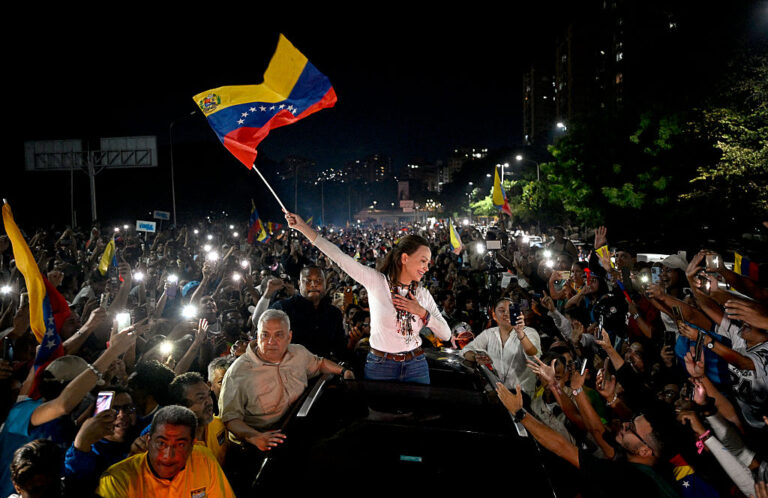 Venezuelan opposition leader Maria Corina Machado greets supporters upon her arrival in Caracas on October 25, 2026.