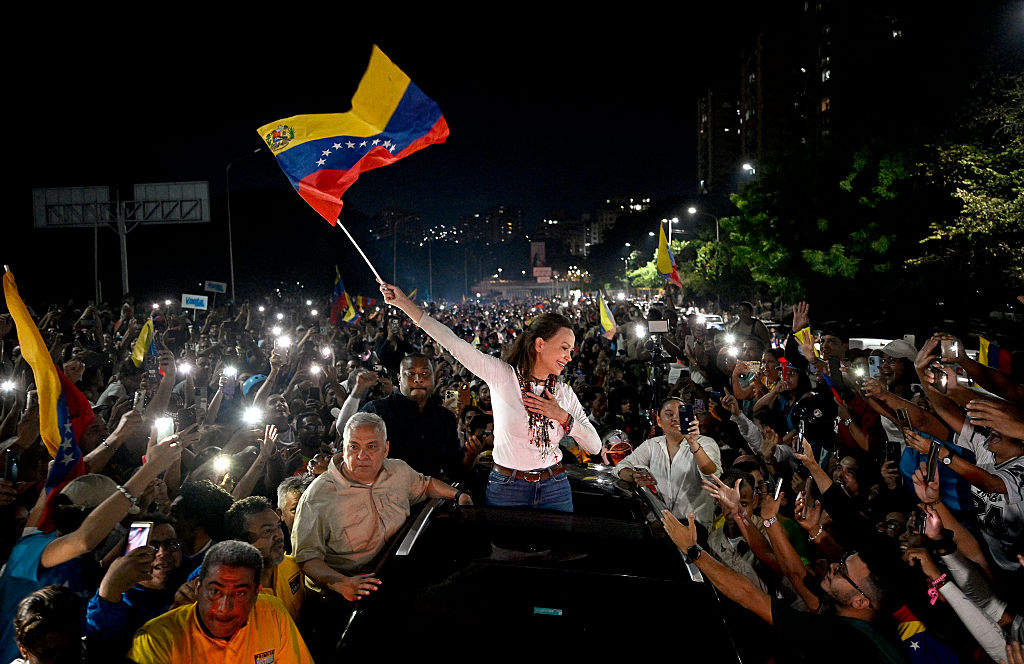 Venezuelan opposition leader Maria Corina Machado greets supporters upon her arrival in Caracas on October 25, 2026.
